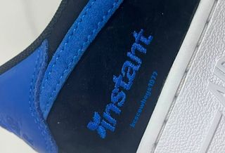 Close-up heel shot of the unreleased Instant Skateboards x Nike SB Air Force 1 "Black/Game Royal/White" collaboration. Photo via Instagram user @kcscowboys1977.