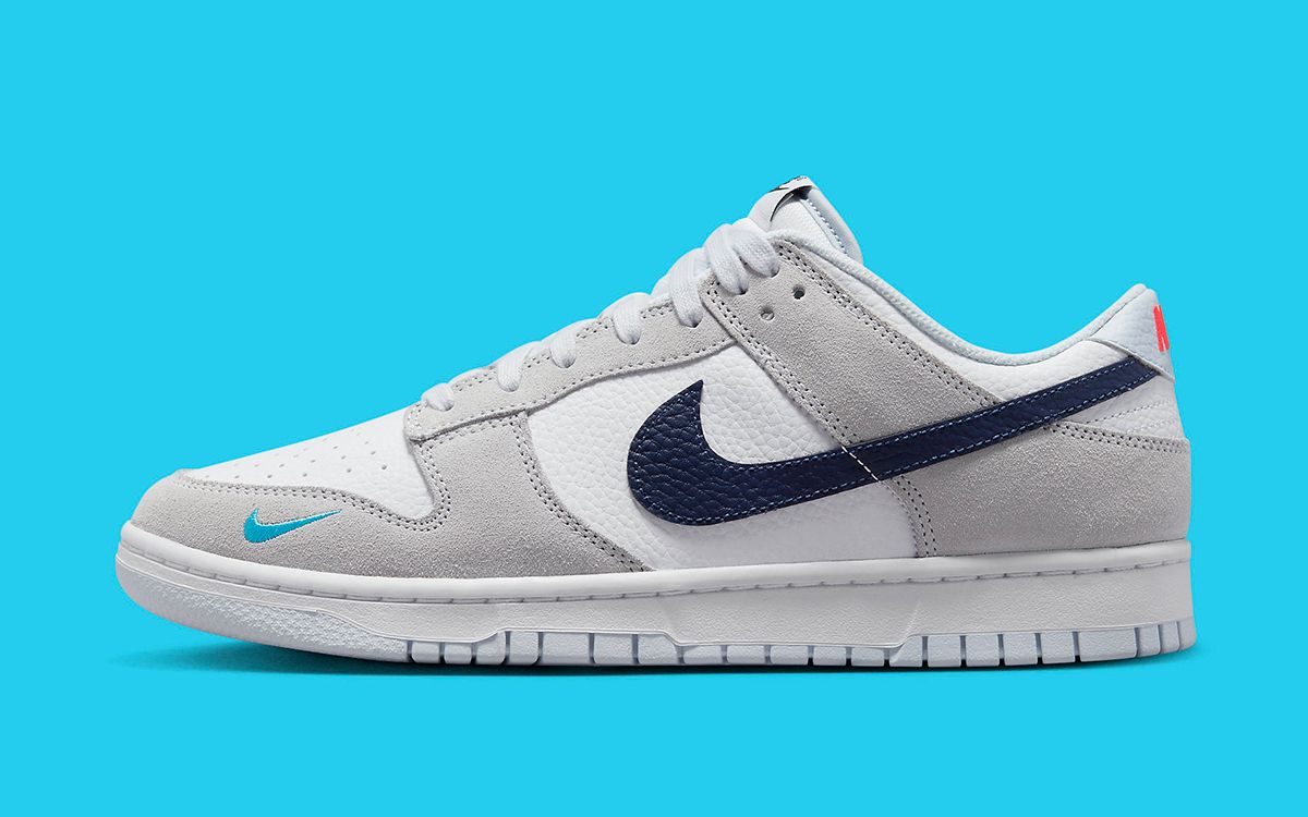 Nike Adds Dual Blue Swooshes to this White and Grey Dunk Low ...