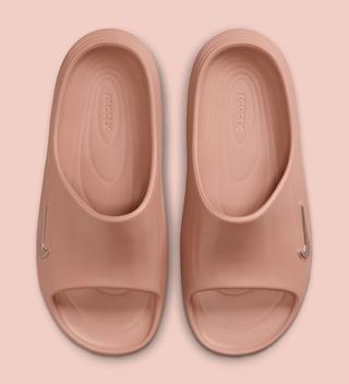 Top-down view of the Women's Nike ReactX Rejuven8 Slide in a "Rose Gold" color scheme.