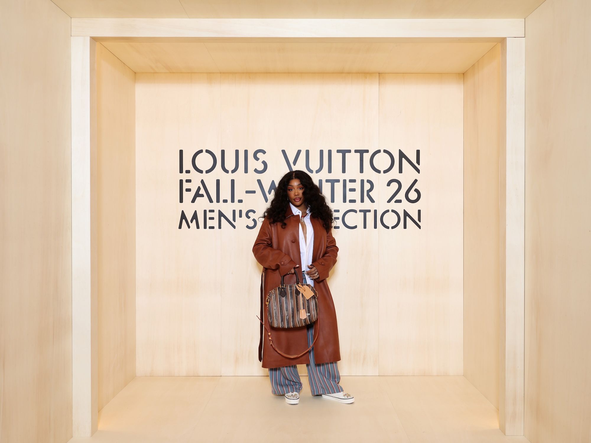 SZA wearing custom Vans by Rachel Goatley while attending Louis Vuitton's Fall/Winter 2026 show in Paris.