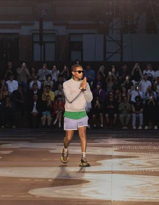 Pharrell wearing "Brown/Yellow" VIRGINIA Adistar Jellyfish in Paris after showing Louis Vuitton SS26 Men’s Collection. Photo by Louis Vuitton.