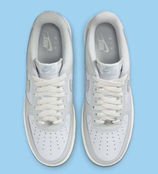 Top-down view of Nike's Air Force 1 Low in a "White/Light Armory Blue/Photon Dust" color scheme.