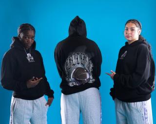 GG Banks, Jordyn Palmer & Jessie Moses wearing the Playa Society x Overtime "BELIEVE" Hoodie. Photo via Overtime.