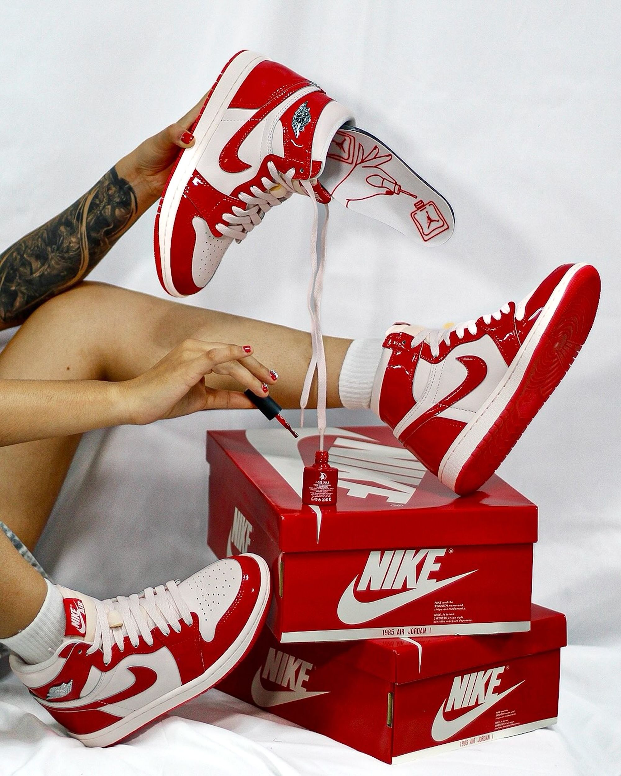 "Nails & Grails" Air Jordan 1 Retro High OG for Women, done in a "University Red/Metallic Silver/Light Soft Pink" color scheme. Photo via @99problemsmx on Instagram.