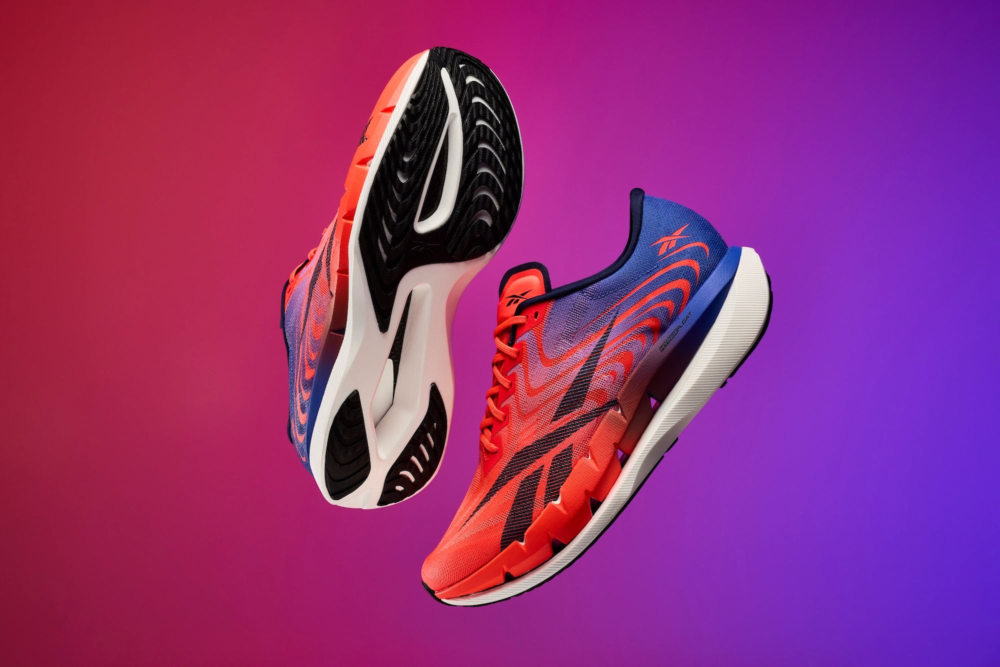 Reebok SpeedShifter unisex carbon plated running shoe in a "Red/Blue/White" color scheme.