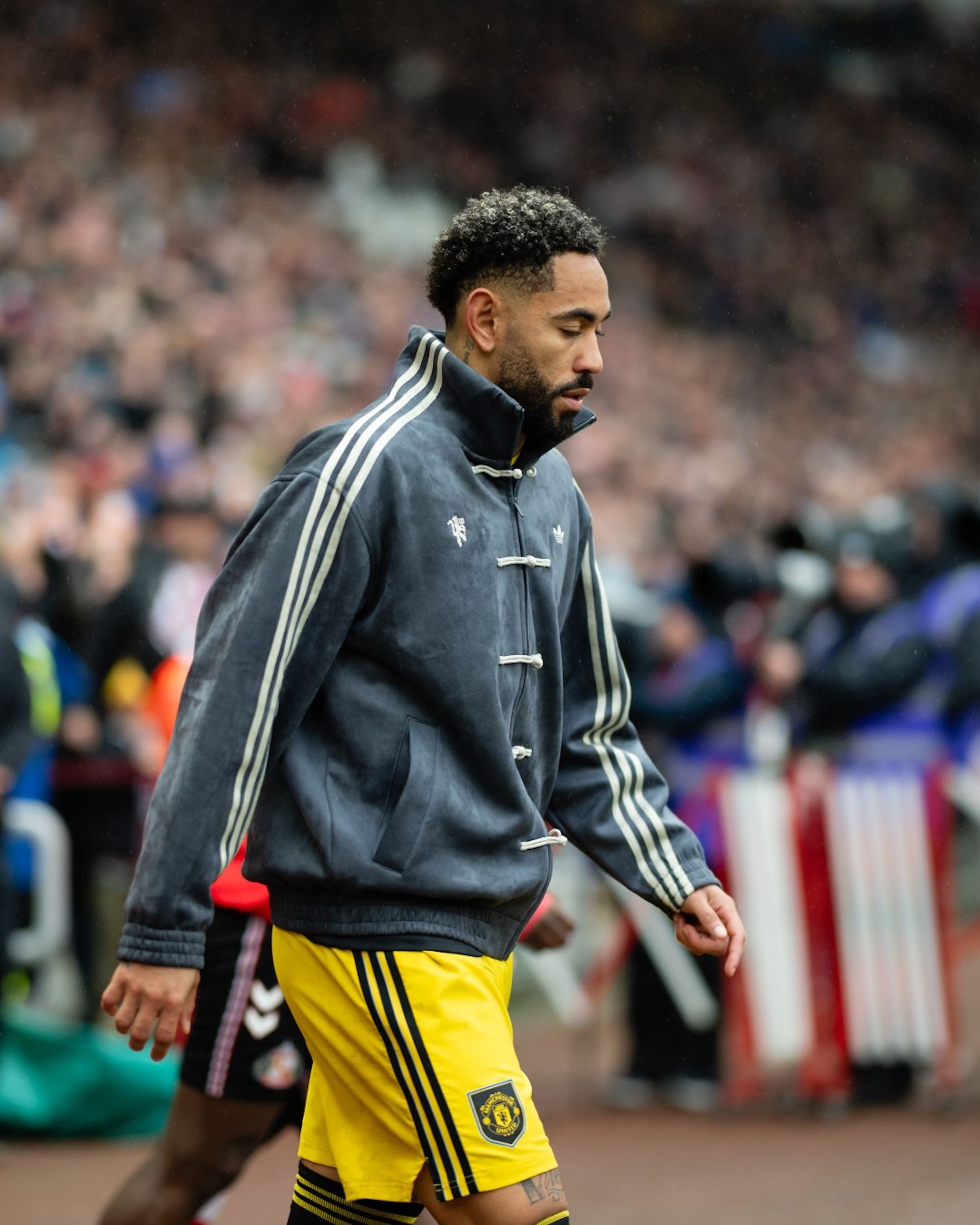Matheus Cunha wearing grey custom Manchester United adidas Chinese New Year Jacket against Sunderland on May 9, 2026.