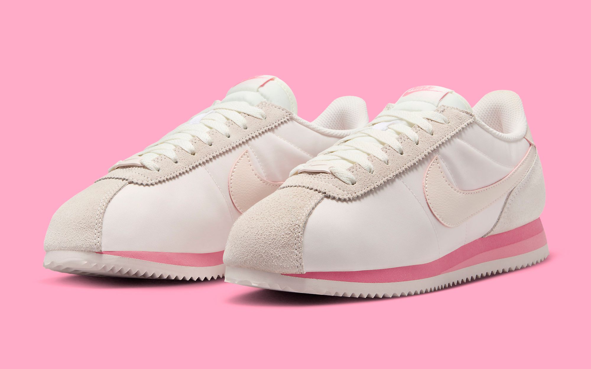 Nike cortez pink on sale swoosh