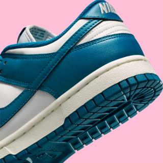 Heel close-up of Nike's Dunk Low clad in a "Green Abyss/Platinum Tint" color scheme.