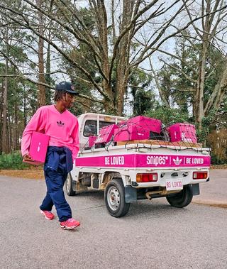 Raud in "Loved Delivered" Campaign, wearing SNIPES' pink-covered adidas AdiStar Control 5 "Be Loved" collaboration.