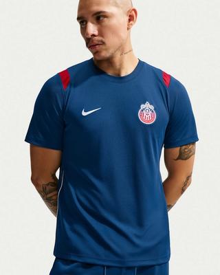 Chivas de Guadalajara Nike Football Academy Pro Short-Sleeve Top in a "Brave Blue" color scheme, complete with a graphic of the club's crest.