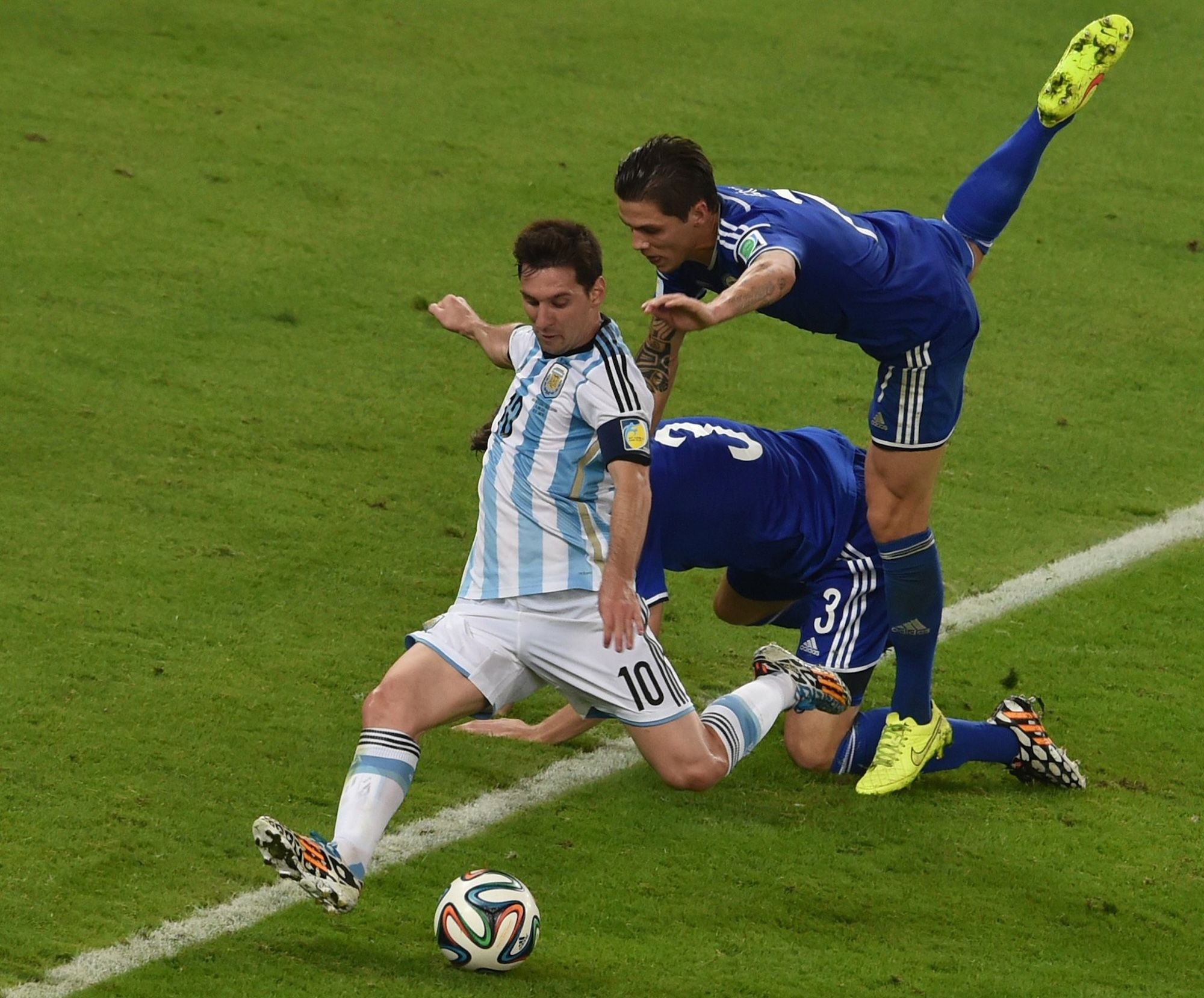 Lionel Messi vs. Bosnia & Herzegovina at the 2014 World Cup™ in Brazil. Photo by Yasuyoshi Chiba/Agence France-Presse via Getty Images/New York Times.