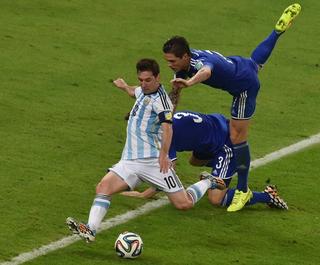Lionel Messi vs. Bosnia & Herzegovina at the 2014 World Cup™ in Brazil. Photo by Yasuyoshi Chiba/Agence France-Presse via Getty Images/New York Times.