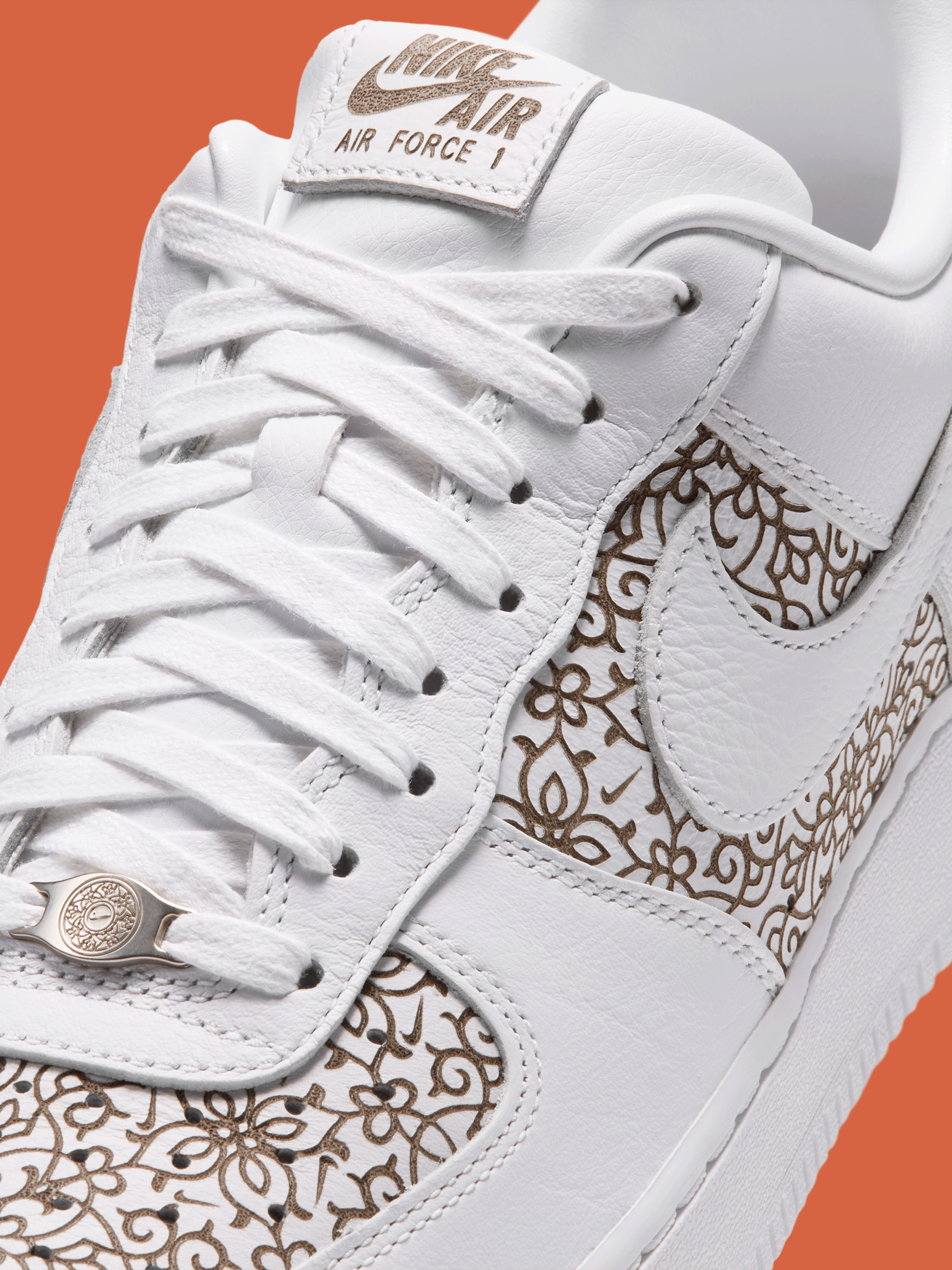 Nike Air Force 1 '07 LV8 "Laser" in an orante, "White/Marrakesh/Picante Red/Light Orewood Brown" color scheme.