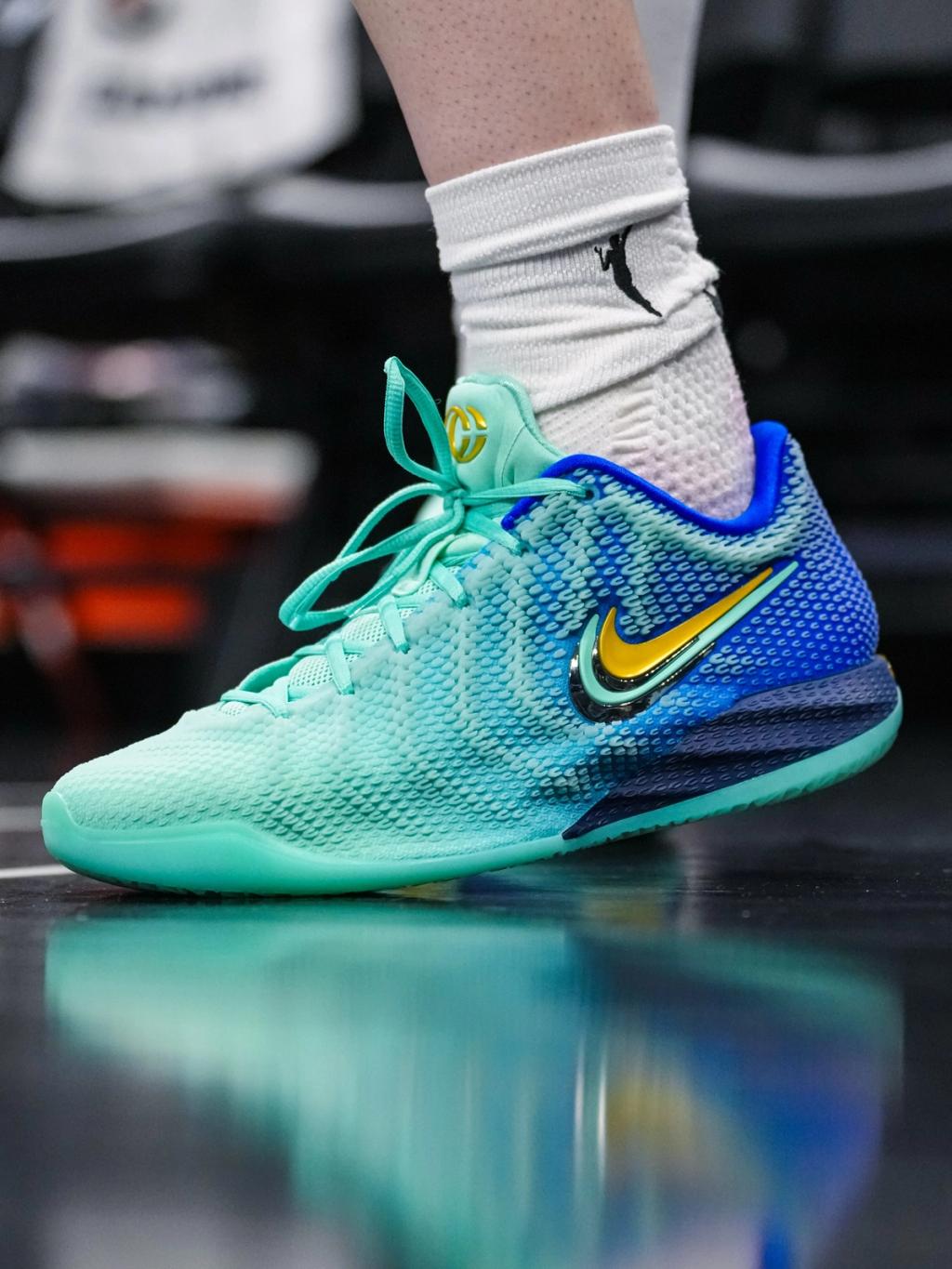 Nike Caitlin 1 Teal Fade colorway displaying the gradient teal upper on the signature basketball shoe