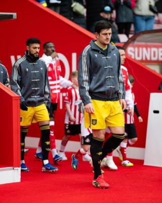Manchester United players wearing custom viral adidas Chinese New Year Jacket in grey on May 9, 2026.