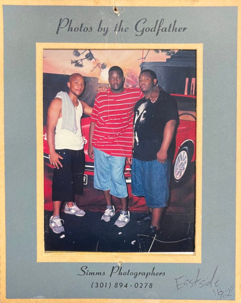 Printed photo from a go-go event at the Eastside Club (1992). Attendees wearing grey, reflective New Balance sneakers. Photo via Nayion Perkins/DCist.