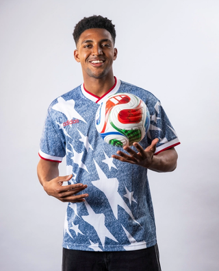 Alex Freeman wearing the adidas 1994 U.S. Denim Kit.