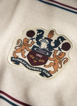 Burnley 26/27 Away Kit Club Crest. Photo via Burnley FC.
