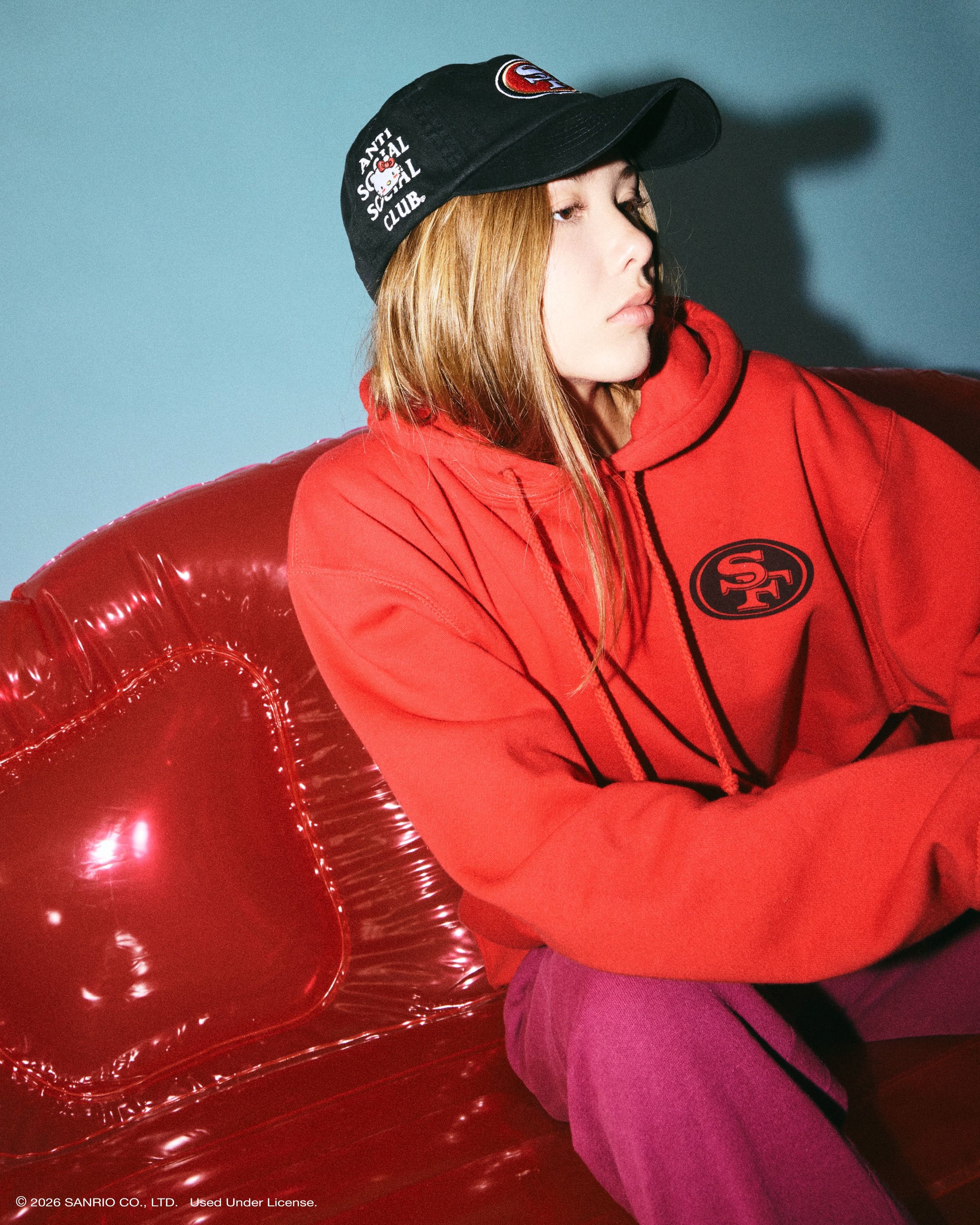 Anti Social Social Club × Hello Kitty NFL collection: red San Francisco 49ers hoodie and cap, lookbook photo via House of Heat