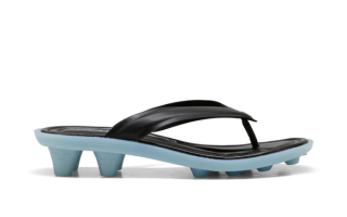 FENTY x PUMA Cat Cleat sandal in a black-and-blue color scheme.