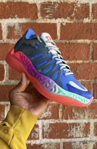 Salehe Bembury previewing Tyrese Haliburton's PUMA Hali 1 in a multi-colored finish.