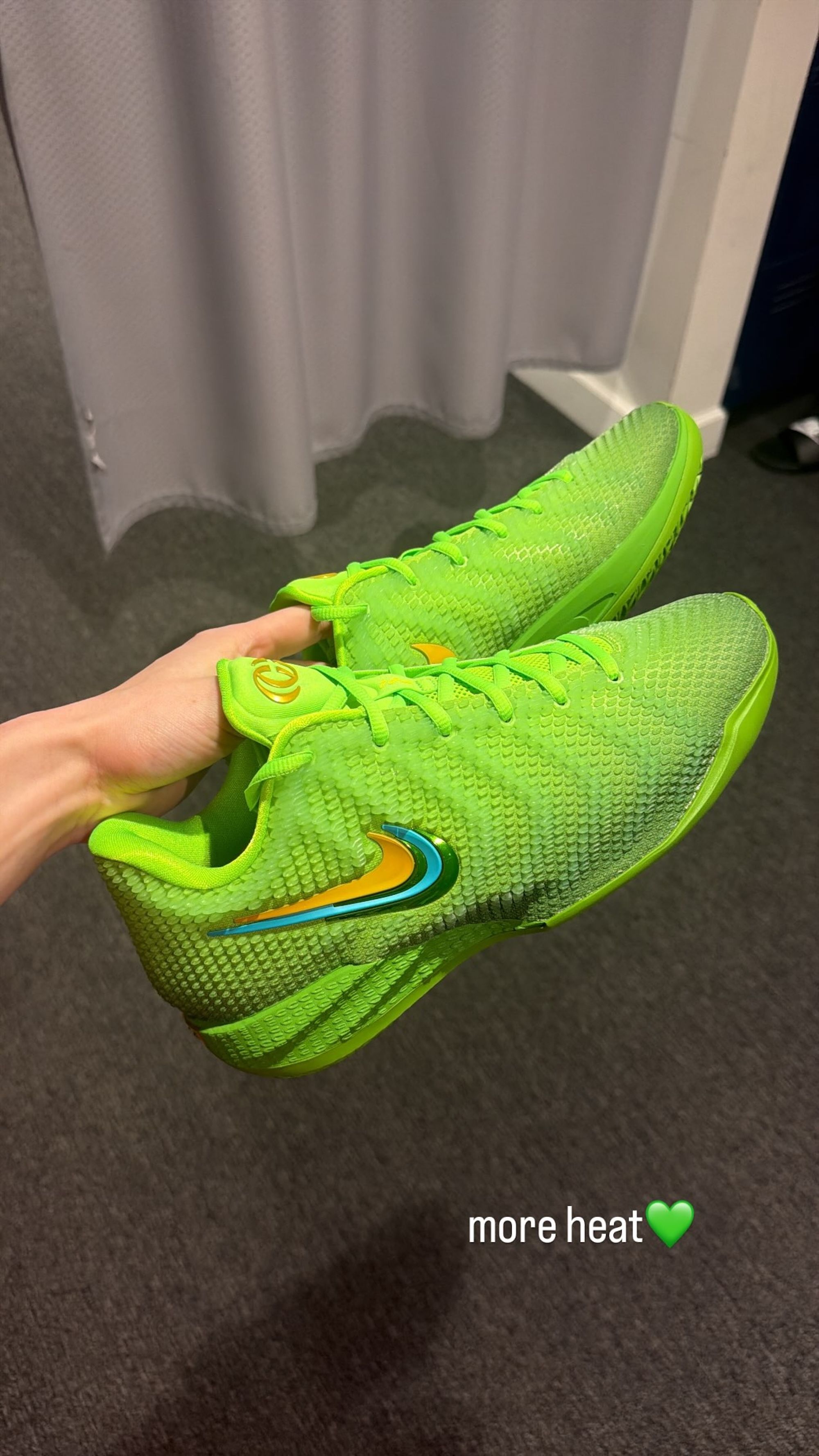 Caitlin Clark's Nike Caitlin 1 basketball shoe in a "Electric Green/Varsity Maize/Dusty Cactus/Chlorophyll/Racer Blue" color scheme. Photo via Caitlin Clark on Instagram Stories.
