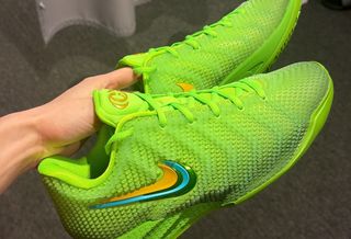 Caitlin Clark's Nike Caitlin 1 basketball shoe in a "Electric Green/Varsity Maize/Dusty Cactus/Chlorophyll/Racer Blue" color scheme. Photo via Caitlin Clark on Instagram Stories.
