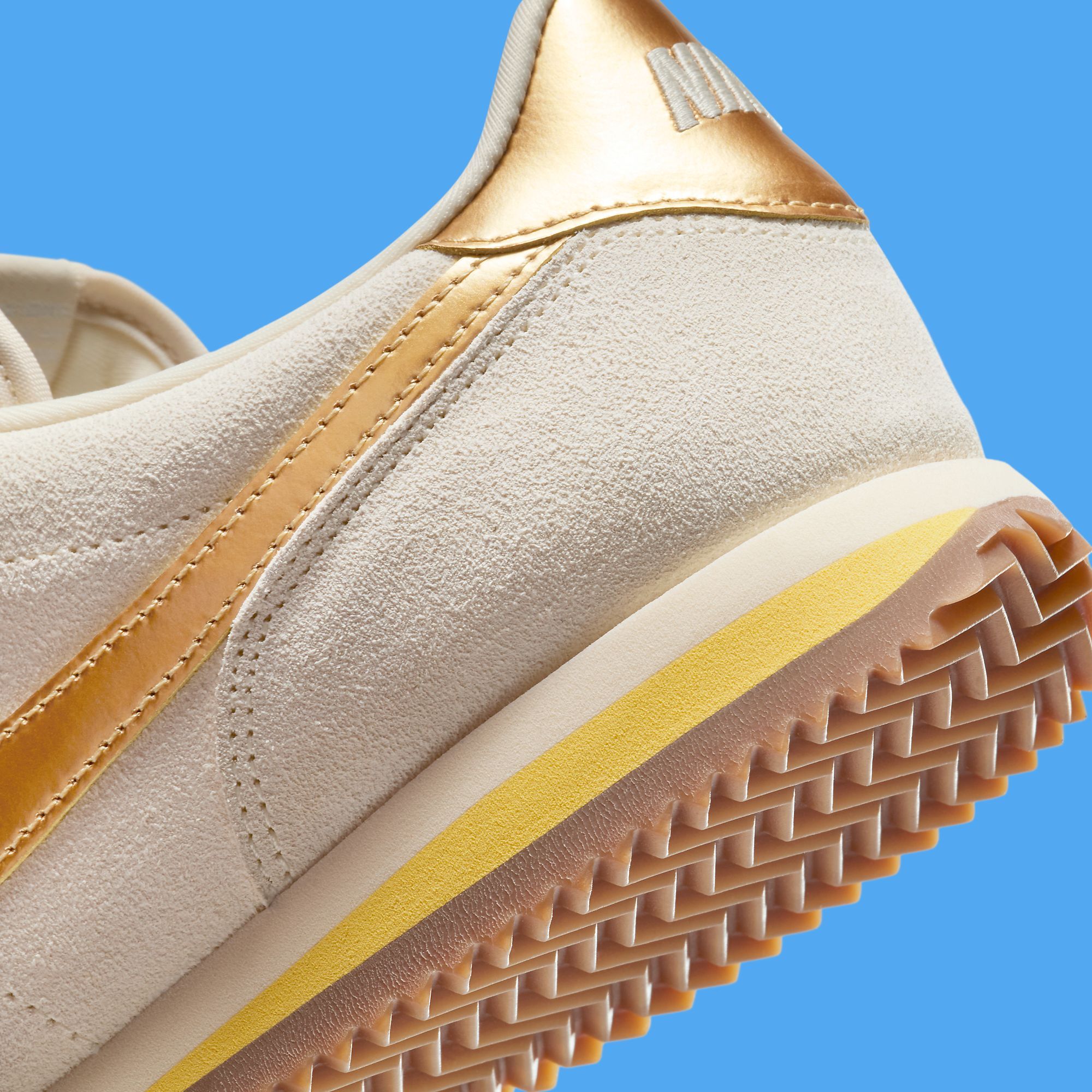 nike taupe with gold swoosh suede cortez trainers