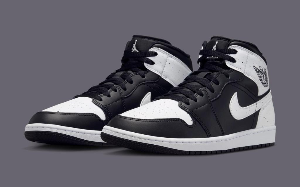 Jordan Brand Air Jordan 1 Mid in black and white Oreo colorway, showing the full lateral and medial side panels