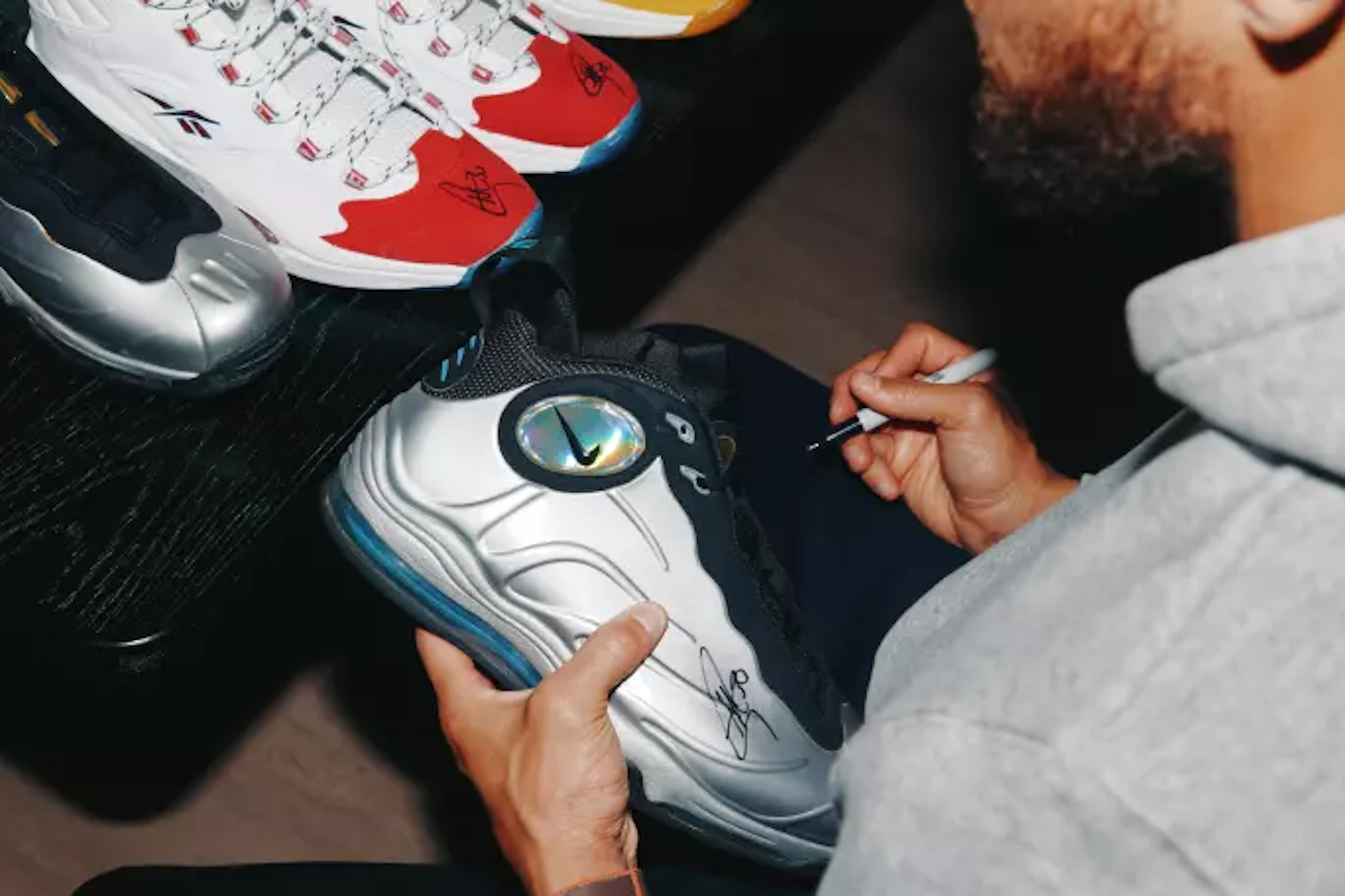 Stephen Curry signing Nike Total Foamposite Max. Photo via Sotheby's.