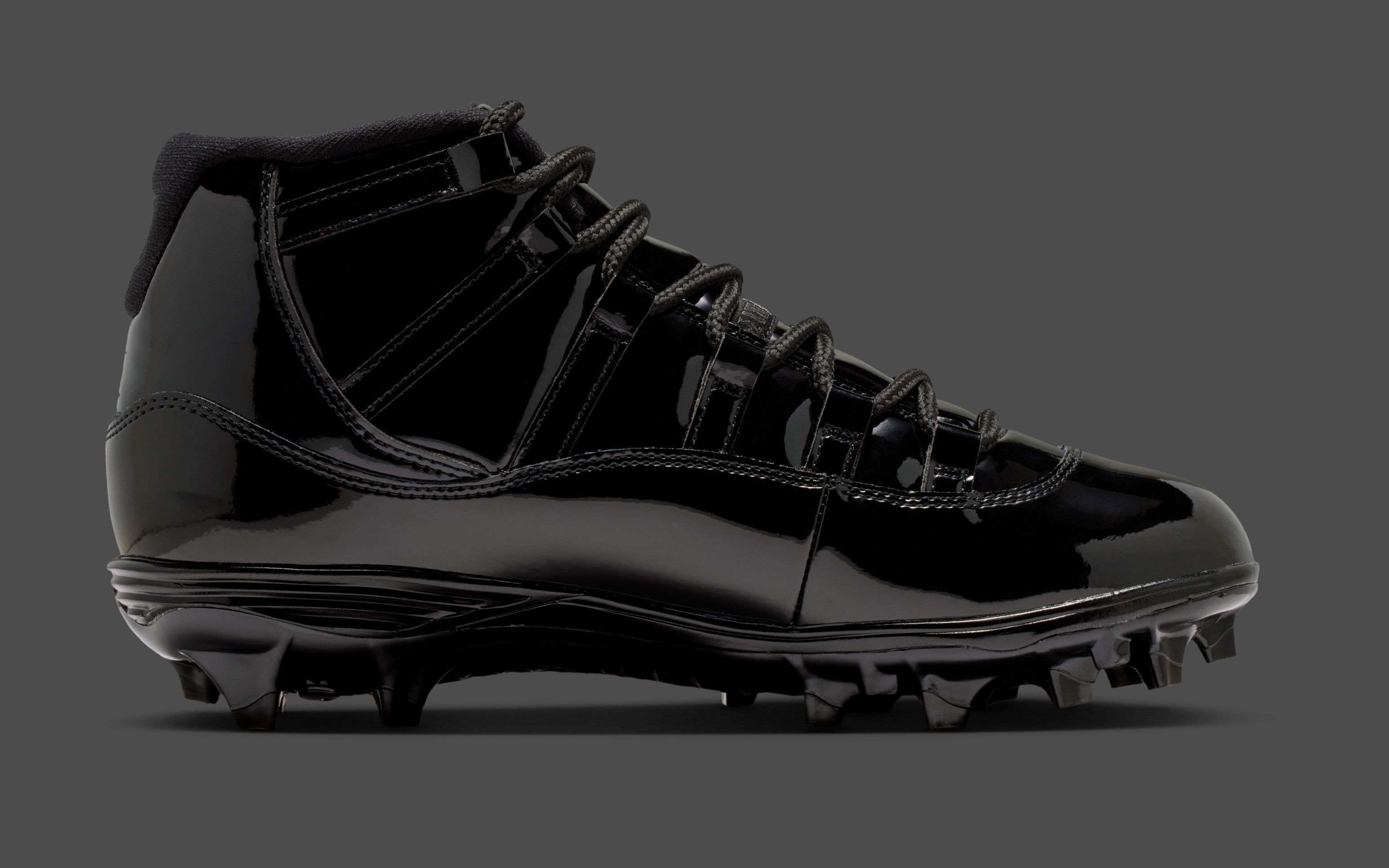all black jordan cleats