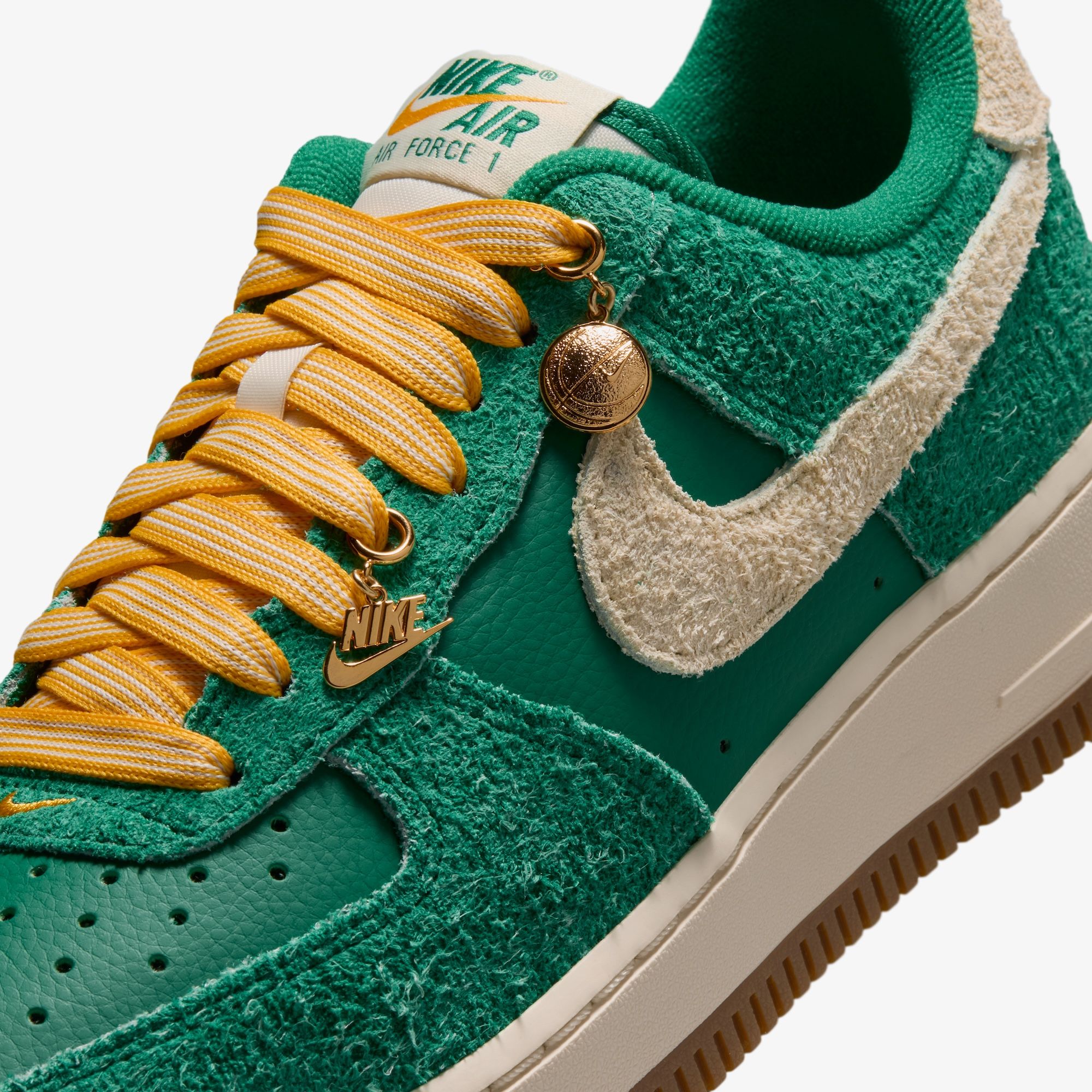 Nike Air Force 1 Low '07 "Game Day" sneaker in a "Malachite/University Gold/Gum Medium Brown/Coconut Milk" color scheme.