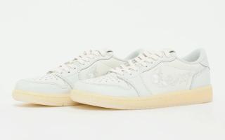 Air Jordan 1 Low OG retro in a "Sail/Off White" color scheme, complete with floral profile swooshes.