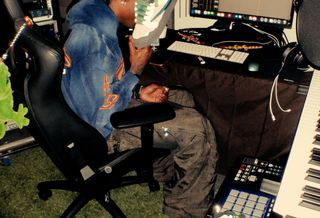 Travis Scott holding an unreleased collaboration with Cactus Plant Flea Market on the Nike Air Flea 1.