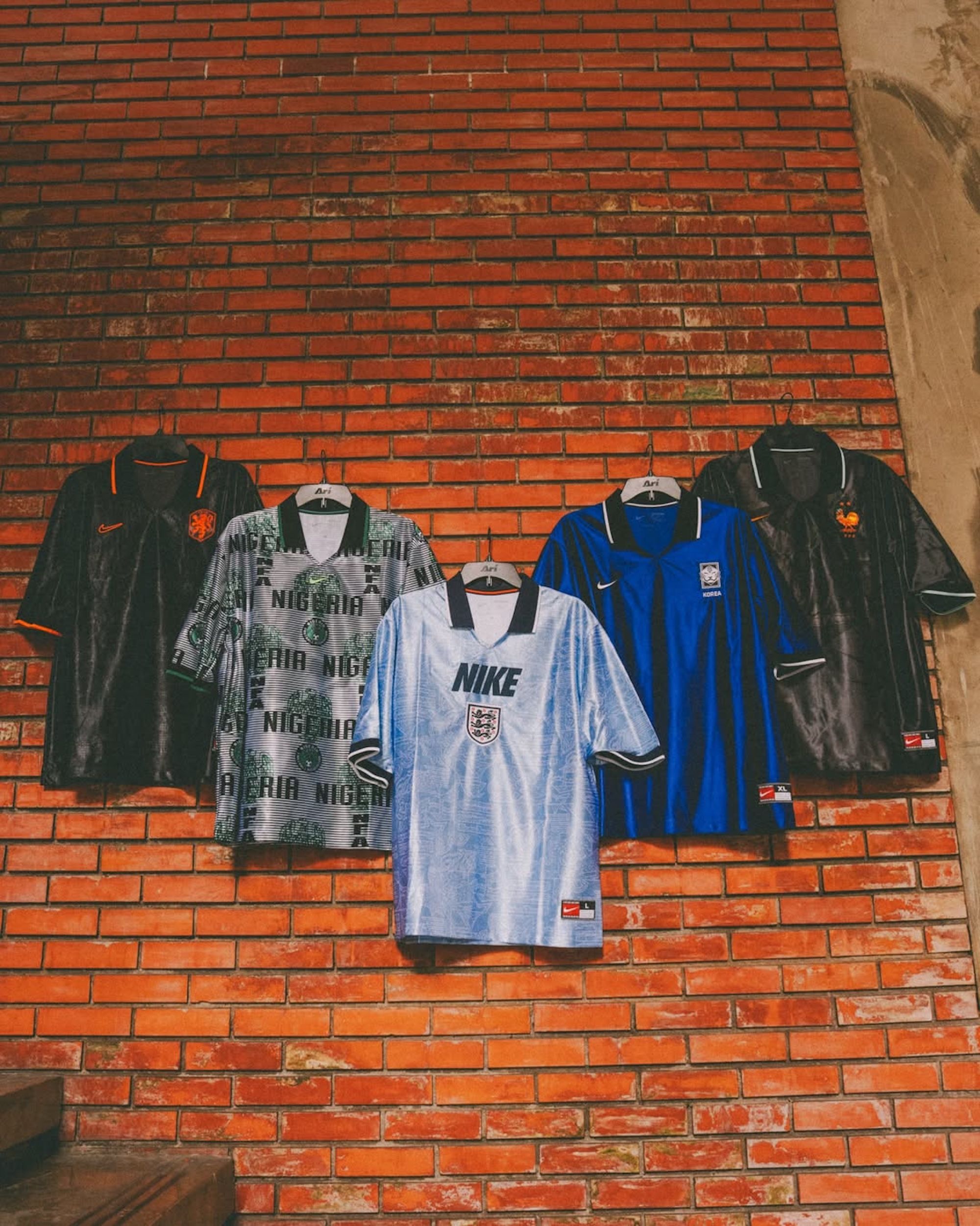 Five different Nike Energy Short-Sleeve Jerseys for football federations The Netherlands, England, South Korea, Nigeria & France. Inspired by the 1990s. Photo via Ari​ Football.
