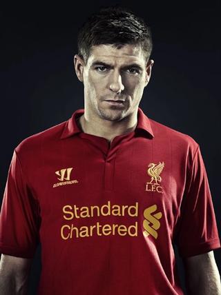 Steven Gerrard wearing Liverpool's 2012/13 Home Jersey by Warrior. Photo via Football Kit News.
