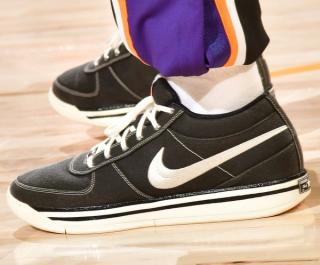 Devin Booker wearing a Converse Chuck Taylor-inspired Nike Book 1. Photo via Nick DePaula on X.