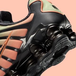 Heel close-up of the Nike Shox TL in an "Off Noir/Olive Aura/Orange Frost" color scheme.