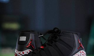 Jordan Brand's special-edition Air Jordan 11 baseball cleats for Japan's Yomiuri Giants, featuring Nomarhythm Textile pattern.