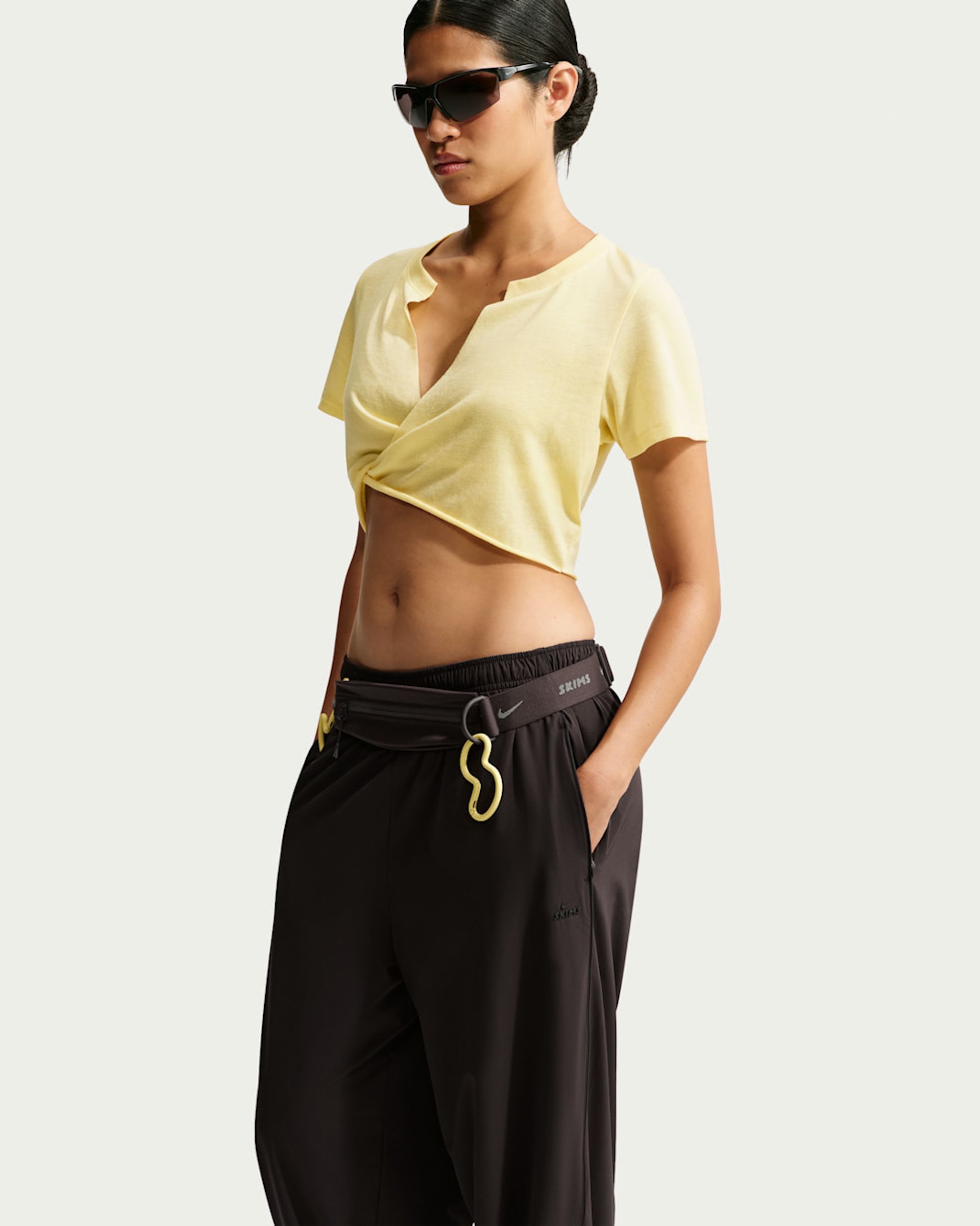 NikeSKIMS Performance Cotton Blend Women's V-Neck Cropped Twist Short-Sleeve Top from the NikeSKIMS Fall 2026 Edit 01 Collection.