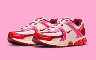 Women's Nike Vomero 5 in a "Light Soft Pink/Team Red/Safety Orange/Light Crimson" color scheme.