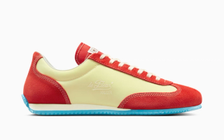 Tyler, The Creator x Converse Coach Jogger in a "French Vanilla/Molten Lava" color scheme.