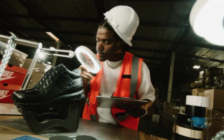 Smino inspecting Wale's "everything is a lot" Nike Air Max Goadome Boots in the Feature Reveal video for the album.