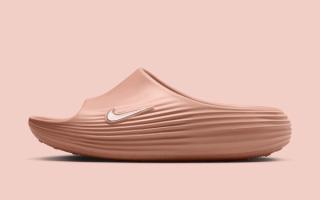 Lateral angle of the Women's Nike ReactX Rejuven8 Slide in a "Rose Gold" color scheme.