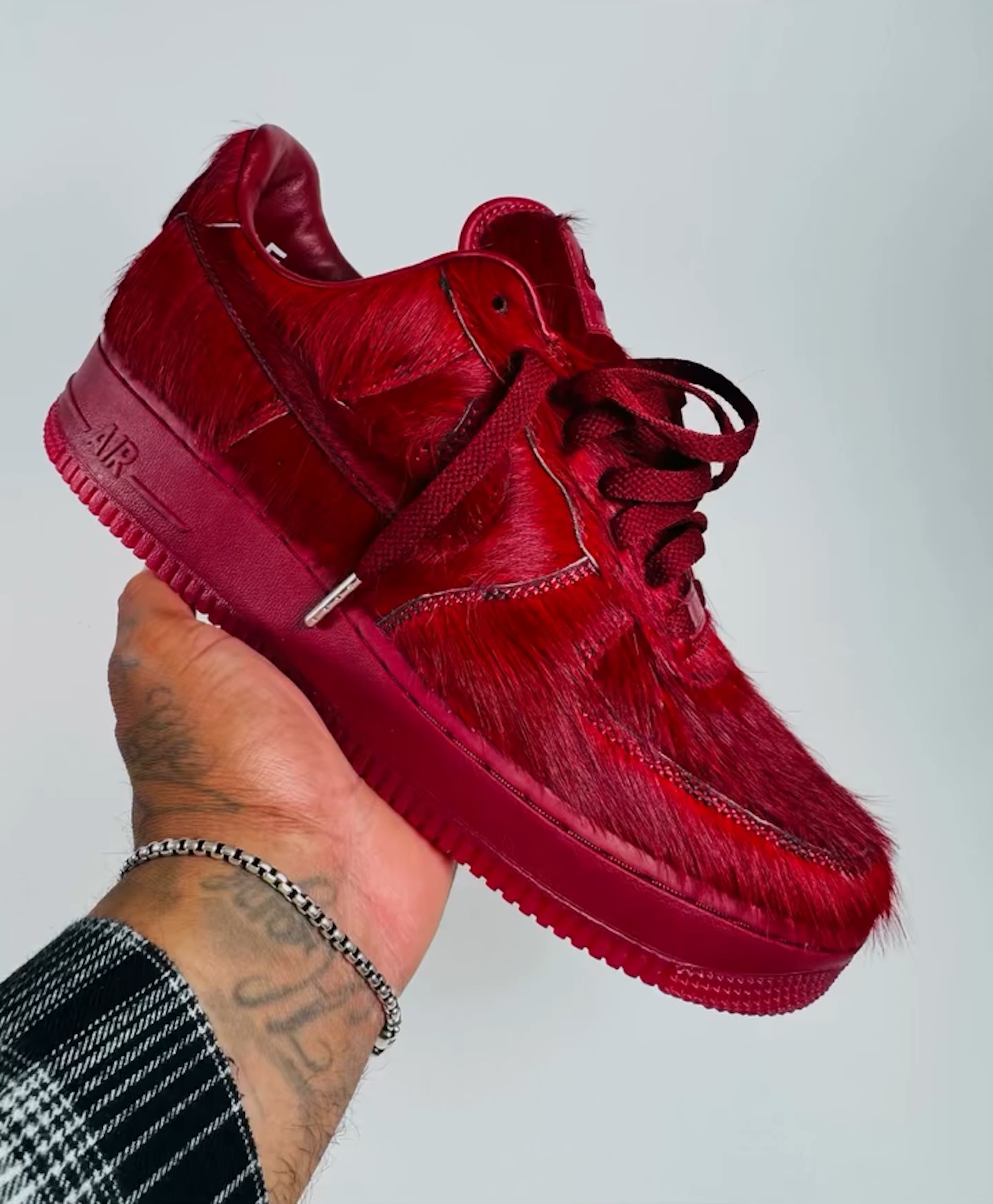 In-Hand: Nike Air Force 1 in a "Team Red" pony hair-covered makeover. Photo via @frankcooker on Instagram.