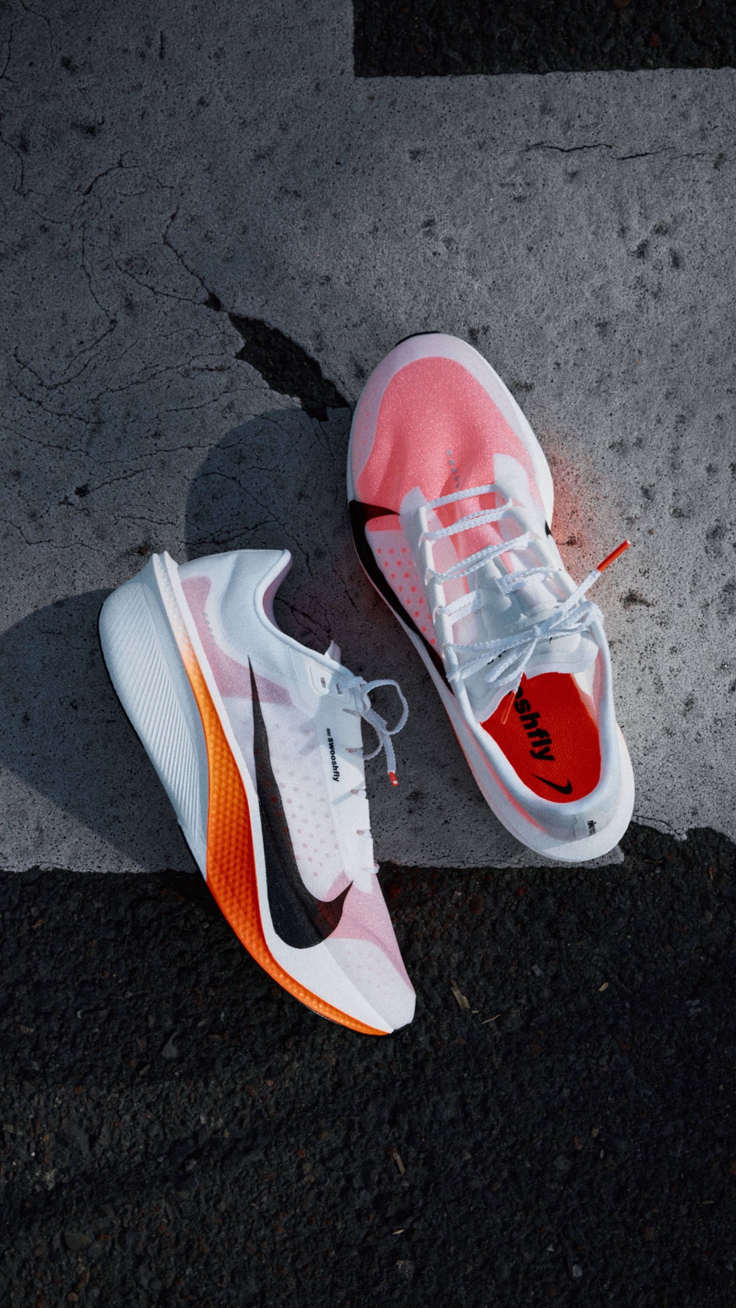All-new Nike Swooshfly marathon racer, informed by athlete insight from China, in a white-and-orange "Proto" color scheme.