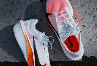 All-new Nike Swooshfly marathon racer, informed by athlete insight from China, in a white-and-orange "Proto" color scheme.