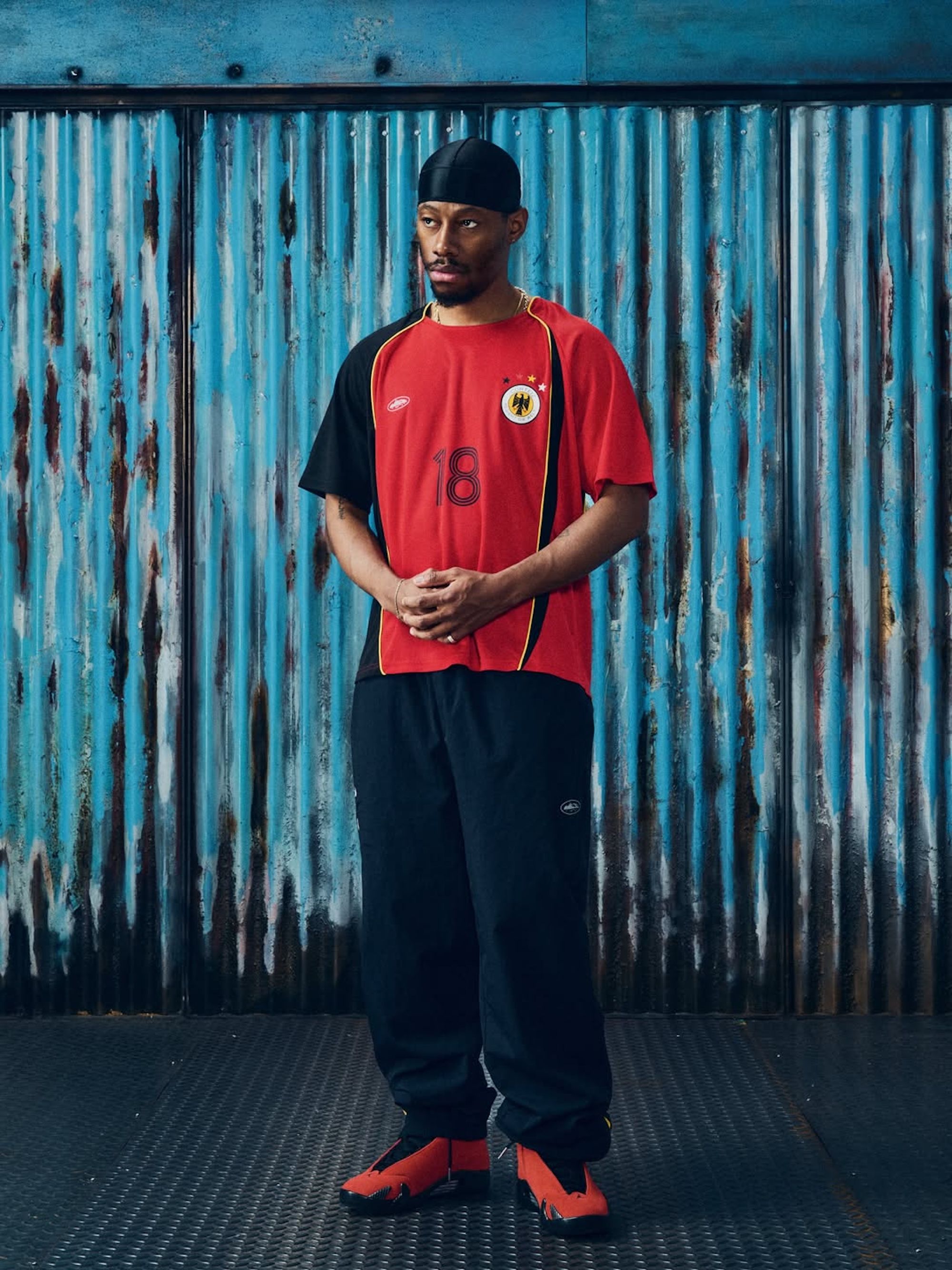 Germany-inspired tracksuit & jersey combinations by Corteiz. Photo via Corteiz.
