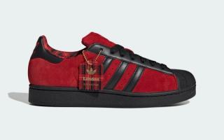Adidas Superstar II "London" sneaker featuring a "Better Scarlet" color and tartan print.
