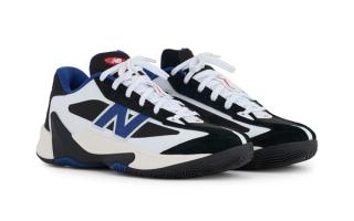 New Balance P350 basketball shoe in a white, black, and blue color scheme.